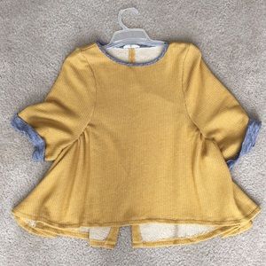 Yellow and gray short sleeve knit top.
